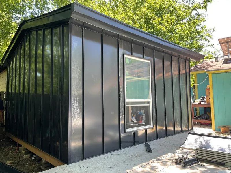 Black standing seam metal wall panels for Roof Inspection in Dartmouth